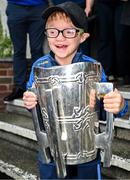21 July 2025; Oisin Crowe, aged 12, from Cappawhite, Tipperary, with the Liam MacCarthy Cup at Children's Health Ireland, Crumlin in Dublin after Tipperary won The Liam MacCarthy Cup at Croke Park on Sunday. Photo by Sam Barnes/Sportsfile
