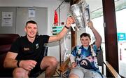 21 July 2025; All-Ireland Hurling Champions Tipperary captain Ronan Maher, left, with Thomas Paul Brophy Barry, aged 10, and the Liam MacCarthy Cup at Children's Health Ireland, Crumlin in Dublin after winning The Liam MacCarthy Cup at Croke Park on Sunday. Photo by Sam Barnes/Sportsfile
