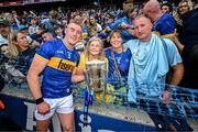 20 July 2025; Eoghan Connolly of Tipperary and family, from left, grandmother Anne, mother Teresa and father TJ celebrate with the Liam MacCarthy cup after their side's victory in the GAA Hurling All-Ireland Senior Championship final match between Cork and Tipperary at Croke Park in Dublin. Photo by Stephen McCarthy/Sportsfile