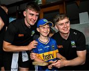 21 July 2025; Tipperary hurlers Sam O'Farrell, left, and Darragh Stakelum, right, with Tadhg Mahony, aged 10, from Newcastle, Tipperary, at Children's Health Ireland, Crumlin in Dublin after winning The Liam MacCarthy Cup at Croke Park on Sunday. Photo by Sam Barnes/Sportsfile
