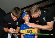 21 July 2025; Tipperary hurlers Sam O'Farrell, left, and Darragh Stakelum, right, with Tadhg Mahony, aged 10, from Newcastle, Tipperary, at Children's Health Ireland, Crumlin in Dublin after winning The Liam MacCarthy Cup at Croke Park on Sunday. Photo by Sam Barnes/Sportsfile