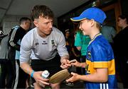 21 July 2025; Tipperary hurler Jake Morris, left, with Tadhg Mahony, aged 10, from Newcastle, Tipperary, at Children's Health Ireland, Crumlin in Dublin after winning The Liam MacCarthy Cup at Croke Park on Sunday. Photo by Sam Barnes/Sportsfile