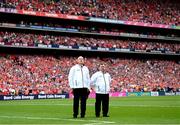 20 July 2025; Umpires stand for the playing of the National Anthem before the GAA Hurling All-Ireland Senior Championship final match between Cork and Tipperary at Croke Park in Dublin. Photo by Stephen McCarthy/Sportsfile
