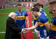 20 July 2025; President of Ireland Michael D Higgins is introduced to Tipperary's Darragh McCarthy by captain Ronan Maher before the GAA Hurling All-Ireland Senior Championship final match between Cork and Tipperary at Croke Park in Dublin. Photo by Stephen McCarthy/Sportsfile