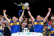20 July 2025; Oisín O'Donoghue, left, and Eoghan Connolly of Tipperary lift the Liam MacCarthy cup after victory in the GAA Hurling All-Ireland Senior Championship final match between Cork and Tipperary at Croke Park in Dublin. Photo by Stephen McCarthy/Sportsfile