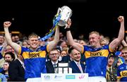 20 July 2025; Oisín O'Donoghue, left, and Eoghan Connolly of Tipperary lift the Liam MacCarthy cup after victory in the GAA Hurling All-Ireland Senior Championship final match between Cork and Tipperary at Croke Park in Dublin. Photo by Stephen McCarthy/Sportsfile