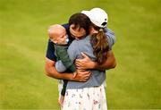 20 July 2025; Scottie Scheffler of USA celebrates with his wife Meredith and son Bennett after winning the final round of The 153rd Open Championship at Royal Portrush Golf Club in Portrush, Antrim. Photo by Ramsey Cardy/Sportsfile