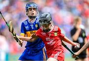 20 July 2025; Páidí Tierney, Church Hill NS, Cuffesgrange, Kilkenny, representing Cork, in action against Cian Harrington, St Mary's SNS, Blessington, Wicklow, representing Tipperary, during the GAA INTO Cumann na mBunscol Respect Exhibition Go Games at the GAA Hurling All-Ireland Senior Championship final match between Cork and Tipperary at Croke Park in Dublin. Photo by Stephen McCarthy/Sportsfile