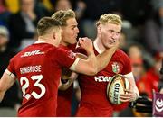 22 July 2025; Jamie Osborne of British & Irish Lions, right, celenrates with teammates Garry Ringrose and Duhan van der Merwe after scoring their side's third try during the tour match between First Nations & Pasifika XV and the British & Irish Lions at Marvel Stadium in Melbourne, Australia. Photo by Brendan Moran/Sportsfile