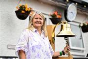 22 July 2025; Lily Owens rings the Roy Torrens Bell before match two of the Women's T20 International Series between Ireland and Zimbabwe at Pembroke Cricket Club in Dublin. Photo by Sam Barnes/Sportsfile