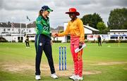 22 July 2025; Ireland captain Gaby Lewis shakes hands with Zimbabwe captain Chipo Spiwe Tiripano before match two of the Women's T20 International Series between Ireland and Zimbabwe at Pembroke Cricket Club in Dublin. Photo by Sam Barnes/Sportsfile