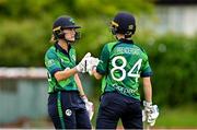 22 July 2025; Ireland batters Gaby Lewis, left, and Orla Prendergast bump fists during match two of the Women's T20 International Series between Ireland and Zimbabwe at Pembroke Cricket Club in Dublin. Photo by Sam Barnes/Sportsfile