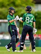 22 July 2025; Ireland batters Gaby Lewis, left, and Orla Prendergast bump fists during match two of the Women's T20 International Series between Ireland and Zimbabwe at Pembroke Cricket Club in Dublin. Photo by Sam Barnes/Sportsfile