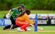 22 July 2025; Tendai Antonate Makusha of Zimbabwe attempts to run out Leah Paul of Ireland during match two of the Women's T20 International Series between Ireland and Zimbabwe at Pembroke Cricket Club in Dublin. Photo by Sam Barnes/Sportsfile