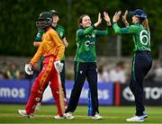22 July 2025; Ireland bowler Lara McBride, centre, and teammate Gaby Lewis celebrate the wicket of Chipo Spiwe Tiripano of Zimbabwe, during match two of the Women's T20 International Series between Ireland and Zimbabwe at Pembroke Cricket Club in Dublin. Photo by Sam Barnes/Sportsfile