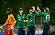 22 July 2025; Ireland bowler Lara McBride, centre, and teammate Gaby Lewis celebrate the wicket of Chipo Spiwe Tiripano of Zimbabwe, during match two of the Women's T20 International Series between Ireland and Zimbabwe at Pembroke Cricket Club in Dublin. Photo by Sam Barnes/Sportsfile