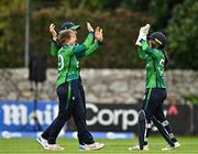22 July 2025; Ireland players, from left, Cara Murray, Gaby Lewis and Amy Hunter celebrate the wicket of Beloved Biza of Zimbabwe during match two of the Women's T20 International Series between Ireland and Zimbabwe at Pembroke Cricket Club in Dublin. Photo by Sam Barnes/Sportsfile