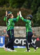22 July 2025; Ireland players, from left, Cara Murray, Gaby Lewis and Amy Hunter celebrate the wicket of Beloved Biza of Zimbabwe during match two of the Women's T20 International Series between Ireland and Zimbabwe at Pembroke Cricket Club in Dublin. Photo by Sam Barnes/Sportsfile