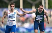 22 July 2025; Jack Raftery, from Castleknock in Dublin, representing Dublin City University and Ireland, right, crosses the line to finish second in the semi-final of the men's 400m during day six of the FISU World University Games 2025 at Lohrheidestadion in Bochum, Germany. Photo by Shauna Clinton/Sportsfile