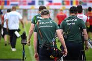 22 July 2025; Archers, from left, Sam Delaney, from Tallaght in Dublin, representing Technological University Dublin and Ireland, Rogan Cunningham, from Killinkere in Cavan, representing Technological University Dublin and Ireland, and Fionn Roche, from Glynn in Wexford, representing Technological University Dublin and Ireland, collect their arrows during the men's compound individual qualification on day six of the FISU World University Games 2025 at Sportpark Am Hallo Stadion in Essen, Germany. Photo by Shauna Clinton/Sportsfile