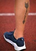 22 July 2025; A tattoo of an arrow is seen during an archery event on day six of the FISU World University Games 2025 at Sportpark Am Hallo Stadion in Essen, Germany. Photo by Shauna Clinton/Sportsfile