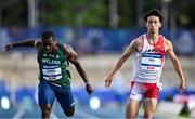 22 July 2025; Toluwabori Akinola, from Balbriggan in Dublin, representing University College Dublin and Ireland, left, crosses the line to finish third in the semi-final of the men's 100m during day six of the FISU World University Games 2025 at Lohrheidestadion in Bochum, Germany. Photo by Shauna Clinton/Sportsfile