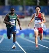 22 July 2025; Toluwabori Akinola, from Balbriggan in Dublin, representing University College Dublin and Ireland, left, on his way to finishing third in the semi-final of the men's 100m during day six of the FISU World University Games 2025 at Lohrheidestadion in Bochum, Germany. Photo by Shauna Clinton/Sportsfile