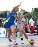 22 July 2025; Helena Keane of Team Ireland in action against Andrada Jaba of Romania during the girls 3x3 Group C match between Team Ireland and Romania during day two of the 2025 European Youth Summer Olympic Festival at East Gate Mall in Skopje, North Macedonia. Photo by Tyler Miller/Sportsfile
