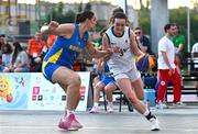 22 July 2025; Helena Keane of Team Ireland in action against Andrada Jaba of Romania during the girls 3x3 Group C match between Team Ireland and Romania during day two of the 2025 European Youth Summer Olympic Festival at East Gate Mall in Skopje, North Macedonia. Photo by Tyler Miller/Sportsfile