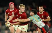 22 July 2025; Fin Smith of British & Irish Lions is tackled by Triston Reilly of First Nations & Pasifika XV during the tour match between First Nations & Pasifika XV and the British & Irish Lions at Marvel Stadium in Melbourne, Australia. Photo by Brendan Moran/Sportsfile