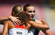23 July 2025; Molly Daly of Team Ireland, right, embraces Kaisa Sol Fagerland of Norway after competing in the girls 200m heats at Todor Proeski National Arena during day three of the 2025 European Youth Summer Olympic Festival in Skopje, North Macedonia. Photo by Tyler Miller/Sportsfile
