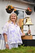 22 July 2025; Lily Owens rings the Roy Torrens Bell before match two of the Women's T20 International Series between Ireland and Zimbabwe at Pembroke Cricket Club in Dublin. Photo by Sam Barnes/Sportsfile