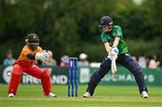 22 July 2025; Ireland batter Orla Prendergast plays a shot watched by Zimbabwe wicketkeeper Modester Mupachikwa during match two of the Women's T20 International Series between Ireland and Zimbabwe at Pembroke Cricket Club in Dublin. Photo by Sam Barnes/Sportsfile