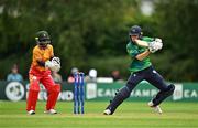 22 July 2025; Ireland batter Orla Prendergast plays a shot watched by Zimbabwe wicketkeeper Modester Mupachikwa during match two of the Women's T20 International Series between Ireland and Zimbabwe at Pembroke Cricket Club in Dublin. Photo by Sam Barnes/Sportsfile