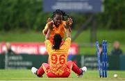 23 July 2025; Zimbabwe bowler Nyasha Gwanzura, 96, celebrates with teammate Runyaroro Tivimbe Paspinodya after taking the wicket of Ireland batter Rebecca Stokell during match three of the Women's T20 International Series between Ireland and Zimbabwe at Sydney Parade in Dublin. Photo by Seb Daly/Sportsfile