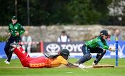 23 July 2025; Ireland wicketkeeper Amy Hunter attempts to run out Zimbabwe batter Chipo Spiwe Tiripano during match three of the Women's T20 International Series between Ireland and Zimbabwe at Sydney Parade in Dublin. Photo by Seb Daly/Sportsfile