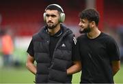 23 July 2025; Qarabag players Tural Bayramov, left, and Kady walk the pitch before the UEFA Champions League Second Qualifying Round first leg match between Shelbourne and Qarabag FK at Tolka Park in Dublin. Photo by Ben McShane/Sportsfile