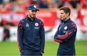 23 July 2025; Shelbourne head coach Joey O'Brien, left, and Shelbourne technical director Luke Byrne during the UEFA Champions League Second Qualifying Round first leg match between Shelbourne and Qarabag FK at Tolka Park in Dublin. Photo by Stephen McCarthy/Sportsfile