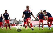 23 July 2025; Shelbourne players including James Norris, centre, warm up before the UEFA Champions League Second Qualifying Round first leg match between Shelbourne and Qarabag FK at Tolka Park in Dublin. Photo by Ben McShane/Sportsfile