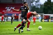 23 July 2025; Mark Coyle of Shelbourne is tackled by Nariman Akhundzade of Qarabag during the UEFA Champions League Second Qualifying Round first leg match between Shelbourne and Qarabag FK at Tolka Park in Dublin. Photo by Ben McShane/Sportsfile