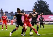 23 July 2025; James Norris of Shelbourne in action against Pedro Bicalho, left, and Leandro Andrade of Qarabag during the UEFA Champions League Second Qualifying Round first leg match between Shelbourne and Qarabag FK at Tolka Park in Dublin. Photo by Stephen McCarthy/Sportsfile