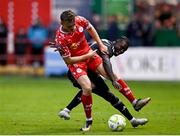 23 July 2025; JJ Lunney of Shelbourne is tackled by Emmanuel Addai of Qarabag during the UEFA Champions League Second Qualifying Round first leg match between Shelbourne and Qarabag FK at Tolka Park in Dublin. Photo by Ben McShane/Sportsfile