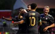 23 July 2025; Nariman Akhundzade of Qarabag, centre, celebrates with teammates, from left, Emmanuel Addai, Abdellah Zoubir and Olexiy Kashchuk after scoring their side's third goal during the UEFA Champions League Second Qualifying Round first leg match between Shelbourne and Qarabag FK at Tolka Park in Dublin. Photo by Ben McShane/Sportsfile