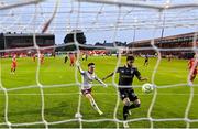 23 July 2025; Nariman Akhundzade of Qarabag scores his side's third goal despite the efforts of Shelbourne goalkeeper Lorcan Healy during the UEFA Champions League Second Qualifying Round first leg match between Shelbourne and Qarabag FK at Tolka Park in Dublin. Photo by Stephen McCarthy/Sportsfile
