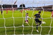 23 July 2025; Nariman Akhundzade of Qarabag scores his side's third goal despite the efforts of Shelbourne goalkeeper Lorcan Healy during the UEFA Champions League Second Qualifying Round first leg match between Shelbourne and Qarabag FK at Tolka Park in Dublin. Photo by Stephen McCarthy/Sportsfile