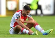 24 July 2025; Zach Elbouzedi of St Patrick's Athletic awaits medical attention during the UEFA Conference League Second Qualifying Round first leg match between St Patrick's Athletic and Nomme Kalju FC at Richmond Park in Dublin. Photo by Stephen McCarthy/Sportsfile