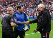 20 July 2025; Dr Con Murphy, right, shakes hands with Tipperary doctor Brendan Murphy in the company of referee Liam Gordon before the GAA Hurling All-Ireland Senior Championship final match between Cork and Tipperary at Croke Park in Dublin. Photo by Ray McManus/Sportsfile