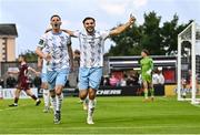 25 July 2025; Pádraig Amond of Waterford celebrates with team-mate Grant Horton, right, after scoring their side's fourth goal, from a penalty, during the SSE Airtricity Men's Premier Division match between Galway United and Waterford at Eamonn Deacy Park in Galway. Photo by Piaras Ó Mídheach/Sportsfile