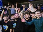 25 July 2025; Waterford supporters celebrate after their side's victory in the SSE Airtricity Men's Premier Division match between Galway United and Waterford at Eamonn Deacy Park in Galway. Photo by Piaras Ó Mídheach/Sportsfile