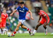 16 July 2025; Euan East of Linfield in action against Mipo Odubeko of Shelbourne during the UEFA Champions League First Qualifying Round second leg match between Linfield and Shelbourne at Clearer Twist National Football Stadium at Windsor Park in Belfast. Photo by Stephen McCarthy/Sportsfile